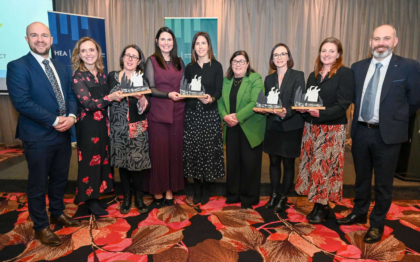 Group photo of the MTU DELTA Award recipients holding their trophies.